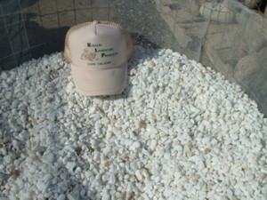 Photo of Dolomite brite white natural stone gravel. Decretive natural stone gravel sold by Rolleri Landscape Products.