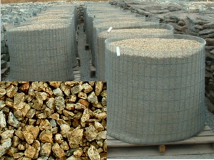 Photo of California Gold Granite natural stone gravel. Decretive natural stone gravel sold by Rolleri Landscape Products.