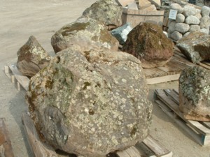 Photo of Rolleri Moss Rock Boulders come in all sizes. Use in landscaping. Natural stone sold by Rolleri Landscape Products.