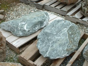 Photo of Green Canyon Crush Boulder. Use in landscaping. Natural stone sold by Rolleri Landscape Products.