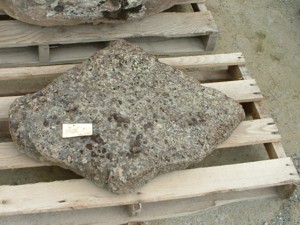Photo of Flat Moss Rock Boulder. Use in landscaping. Natural stone sold by Rolleri Landscape Products.