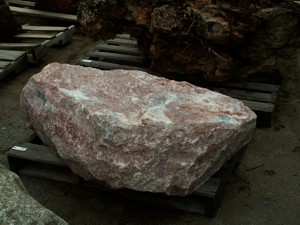Phot of Canadian Mica Reed Boulder. Use in landscaping. Natural stone sold by Rolleri Landscape Products.