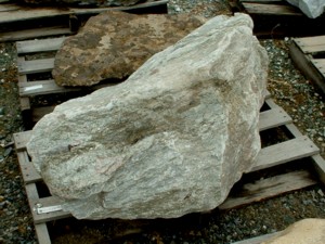 Photo of Canadian Mica Green Boulder. Use in landscaping. Natural stone sold by Rolleri Landscape Products.