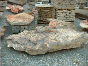 Photo of Swirlly Boulder. Use in landscaping. Natural stone sold by Rolleri Landscape Products.