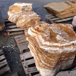 Photo of Onyx Boulder. Use in landscaping. Natural stone sold by Rolleri Landscape Products.