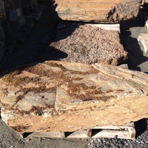 Photo of Schist Boulder. Use in landscaping. Natural stone sold by Rolleri Landscape Products.