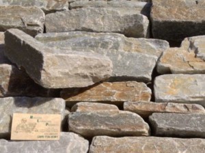 Photo of Gold Rush Quartzite Ledge Tumbled Veneer. Sawed Natural Stone Veneer sold by Rolleri Landscape Products.